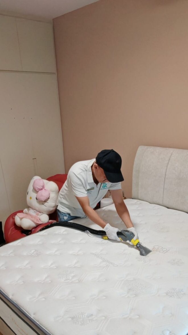 UltraRevive mattress dust-mite cleaning beside a child's cot in Singapore