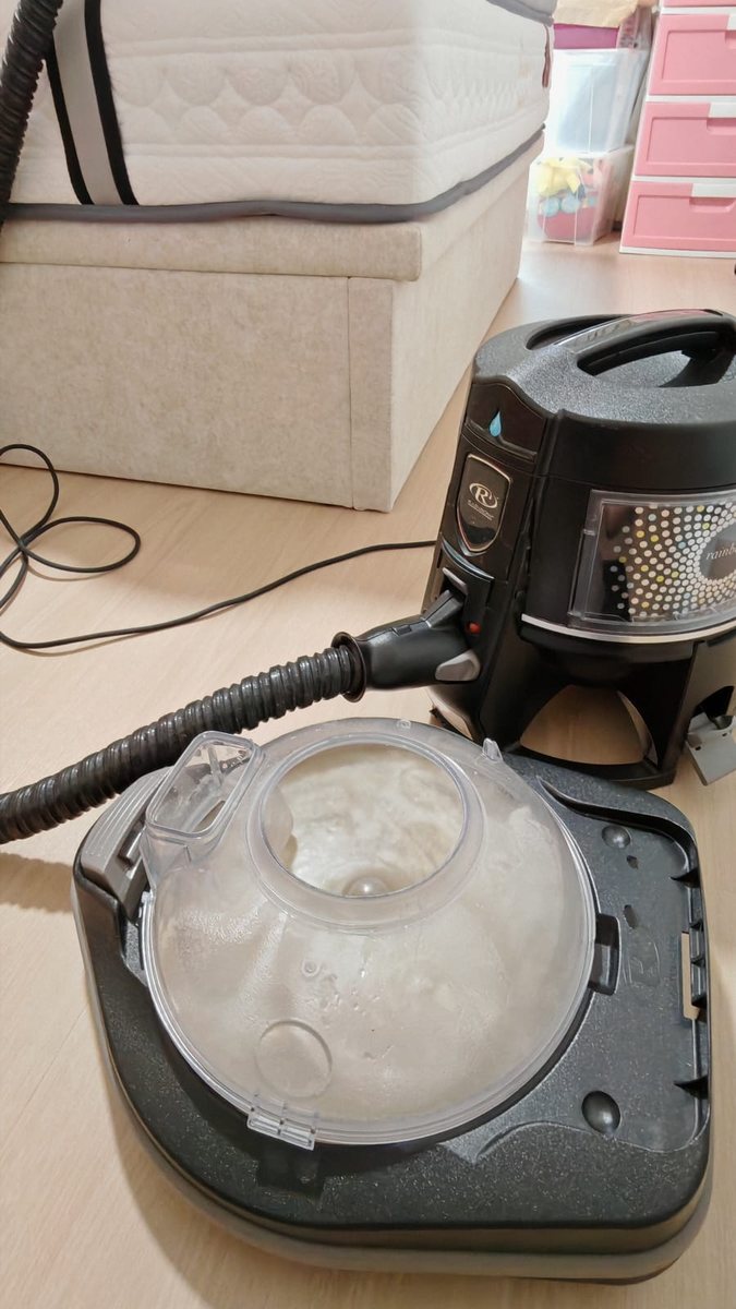 UltraRevive cleaning machine showing dirt extracted from a Singapore mattress